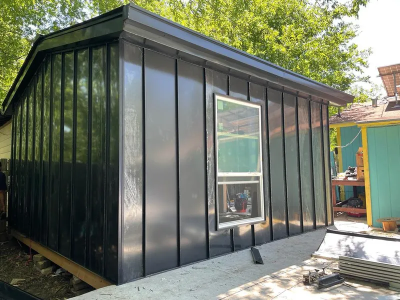 Black standing seam metal wall panels for Metal Roof Installation in Cohasset